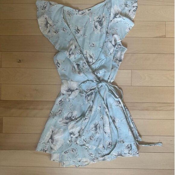 Soft and romantic wrap mini dress in a pale blue floral print by Free People - Picture 2 of 8